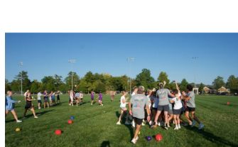 Students gathered on the field during Greek Week